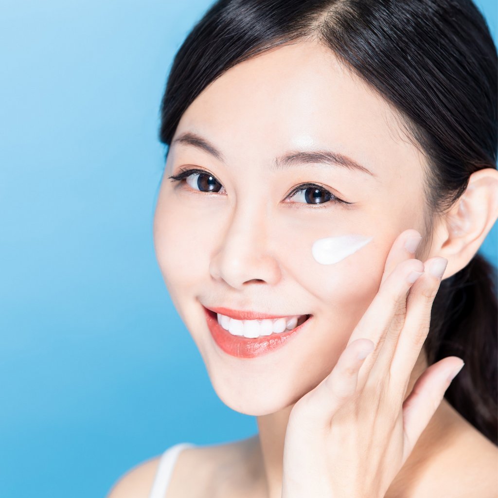 A woman using Hyaluronic acid moisturizer by sm body care