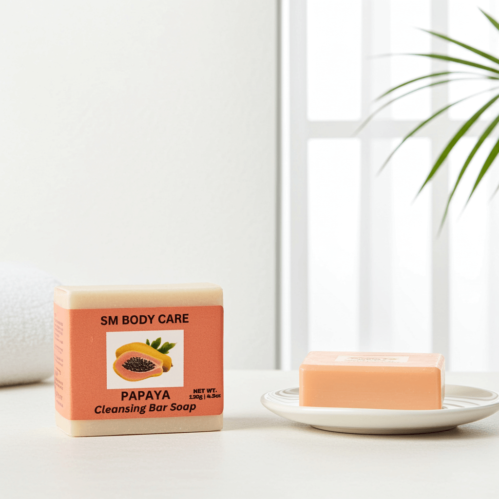 Papaya cleansing bar soap with packaging on a white surface with a plant in the background