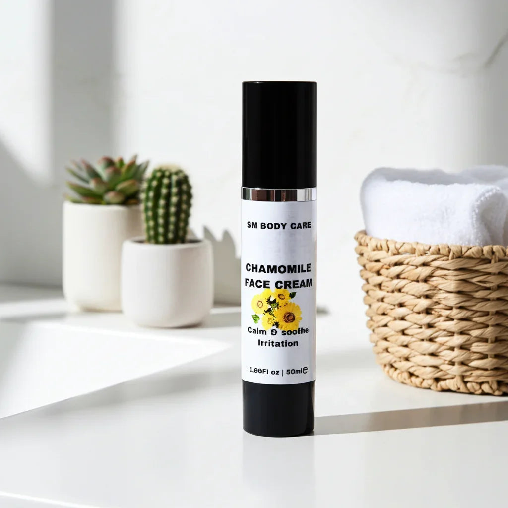 Chamomile face cream bottle on a white surface with plants and a basket in the background