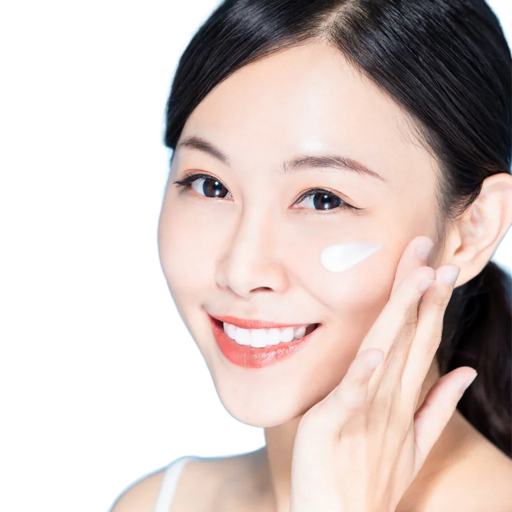 Woman applying SM Body Care hyaluronic acid moisturizer cream to her face with a white background