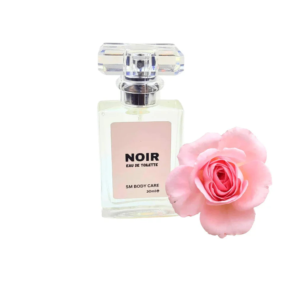 Perfume bottle labeled 'NOIR' with a pink rose on a white background